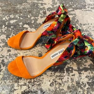 Gently used Steve Madden orange heel with multi colored strappy leg tie
